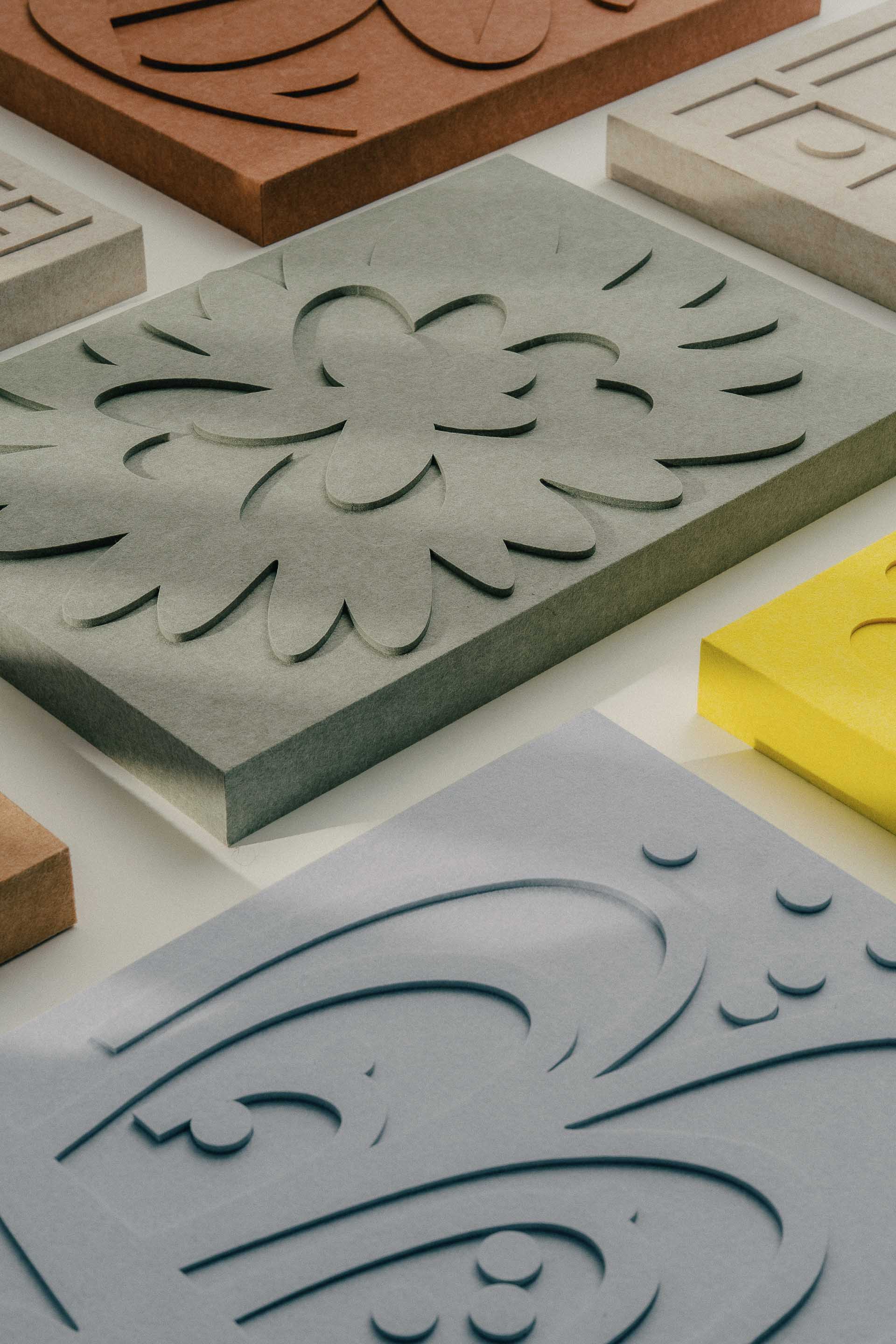 Set of reliefs by LUDISM and Bafeo – artistic sound-absorbing panels inspired by Polish folk culture.